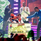 A winner celebrates nailing a half-court shot at the 2014 Nickelodeon Kids' Choice Sports Awards.